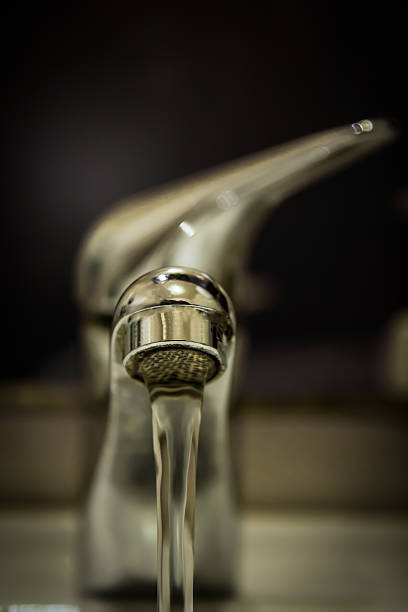 istock Bathroom faucet with water drop. 490651743