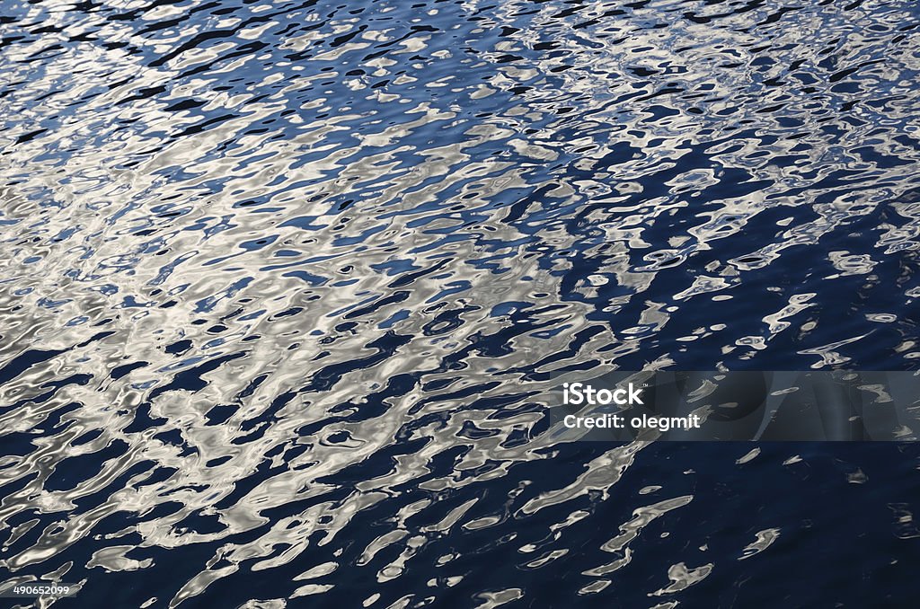 Water surface Wavy surface of the water with specks of the sunlight Backgrounds Stock Photo