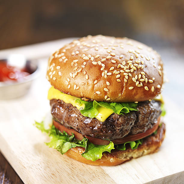 istock burger with sesame bun and melted cheese close up 490652977