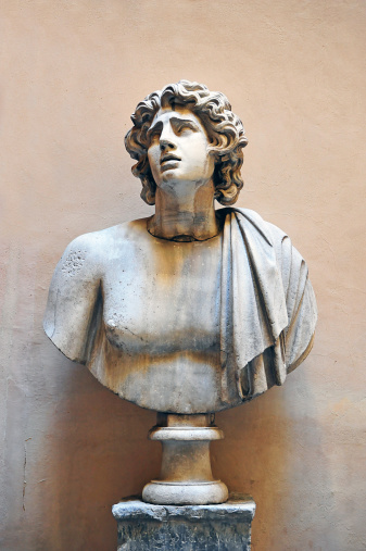 Random and numerous ancient sculpted busts adorn street corners and alcoves throughout the city of Rome, Italy