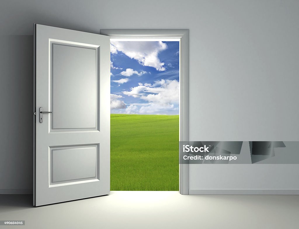 white open door white open door inside empty room with view to green field and cloud sky background Agricultural Field Stock Photo