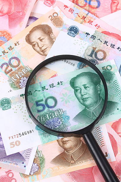 istock Chinese money and the magnifier 490654471