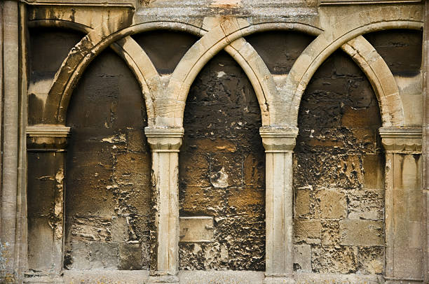 istock Malmesbury Abbey Stone wall Arch Detail 490654651