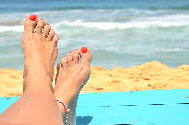 Woman sunbathing at the beach coast