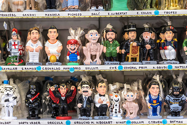 Santa Llucia Fair, Barcelona Barcelona, Spain - December 19, 2014: Santa Llucia Fair is a Christmas market items where a significant figure is the Caganer, typical figure Catalan manger. This figure represents someone defecating, now you also put faces of famous people. humphrey bogart stock pictures, royalty-free photos & images
