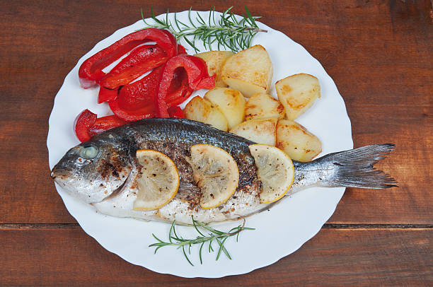 istock Grilled sea bream fish with vegetables 490658869