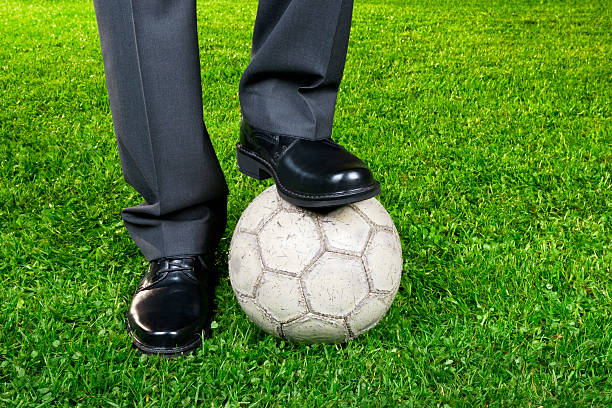 istock Businessman playing with soccer ball 490659317