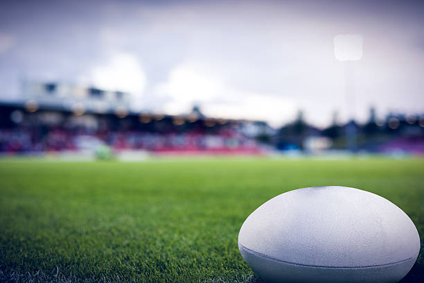 Old AFL football on the grass during a team warm-up