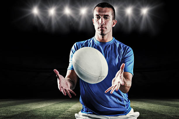 istock Composite image of rugby player trying to catch the ball 490659428