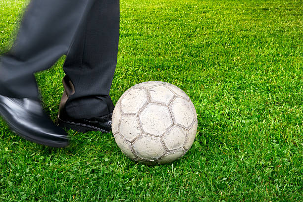 istock Businessman playing with soccer ball 490659451
