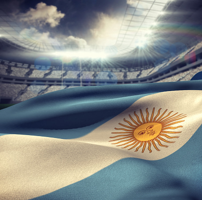 Argentina flag waving in wind against rugby stadium