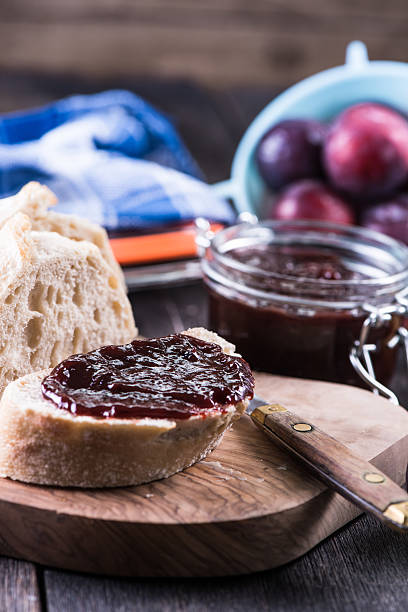 Homemade plum jam with fresh bread