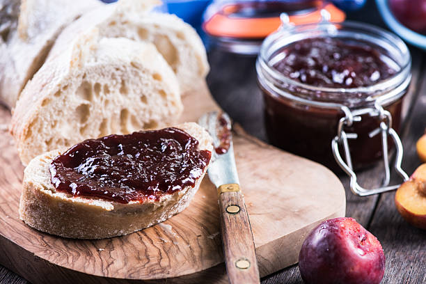 istock Homemade plum jam with fresh bread 490660312