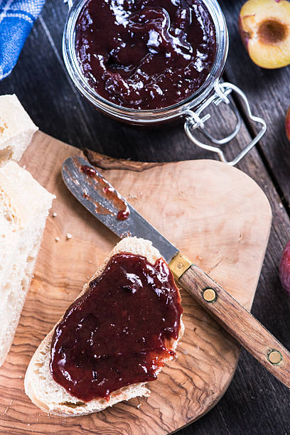 Homemade plum jam with fresh bread