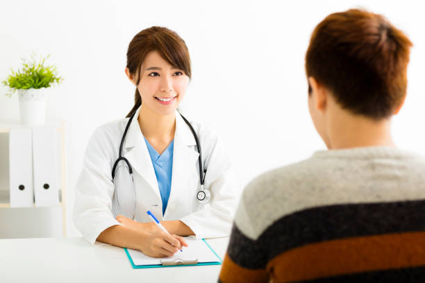 istock female doctor talking with  patient in  office 490660640