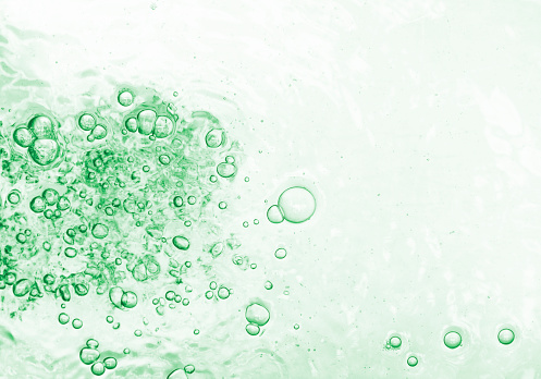 Bubbles in water. Green natural background.