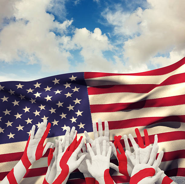 istock Composite image of people raising hands in the air 490661226