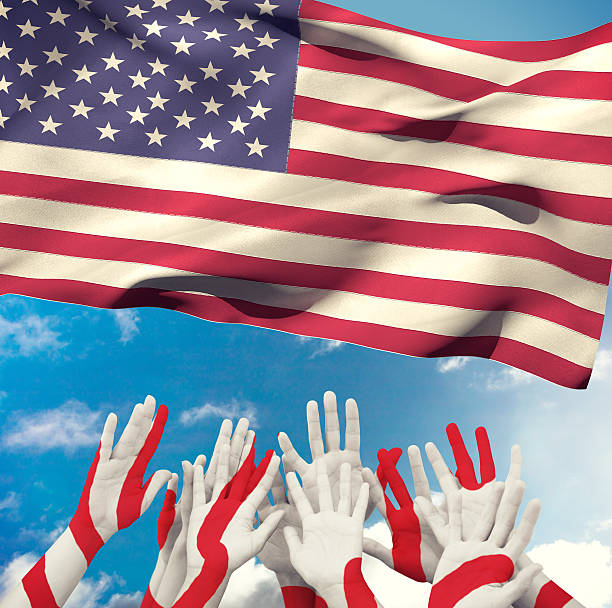 istock Composite image of people raising hands in the air 490661616