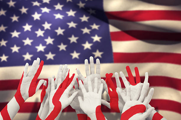 istock Composite image of people raising hands in the air 490662120