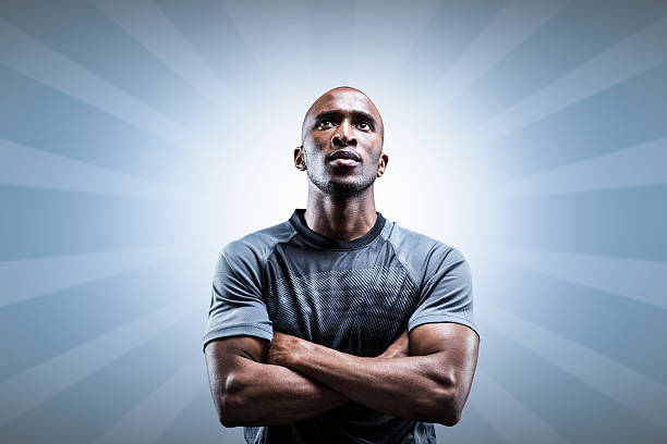 istock Composite image of thoughtful rugby player with arms crossed 490664096