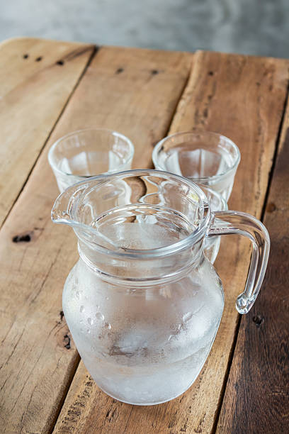 istock Glass pitcher of water and glass. 490664716