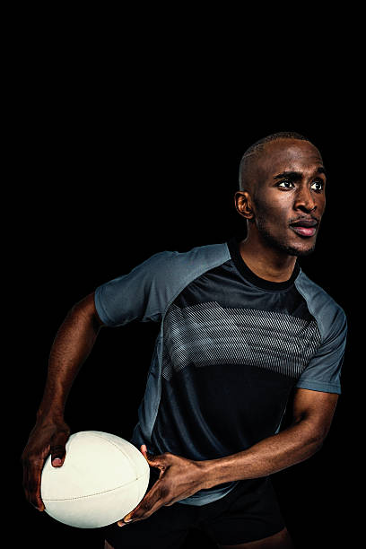istock Composite image of rugby player holding ball 490665436