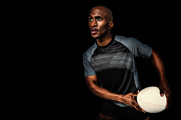 istock Composite image of rugby player holding ball 490665746