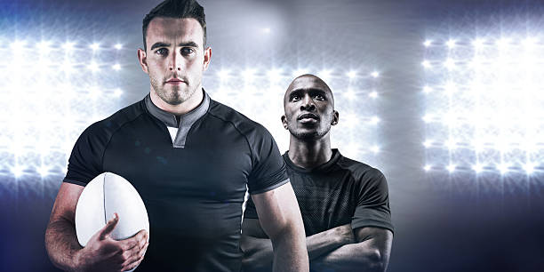 istock Composite image of tough rugby player holding ball 490667980