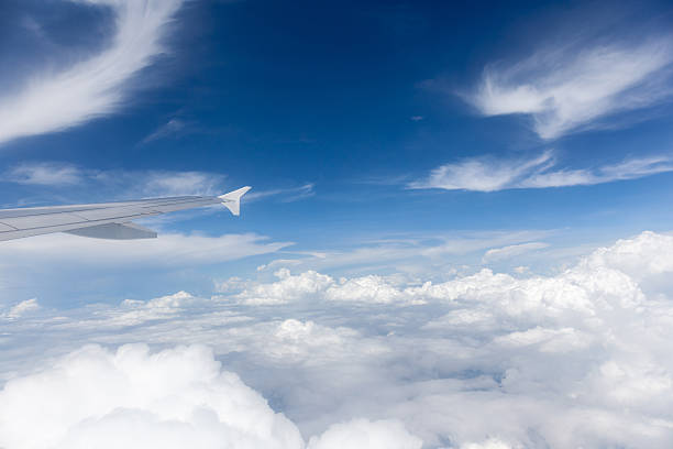 istock View from the airplane window, the beautiful cloudscape in sunny 490668126