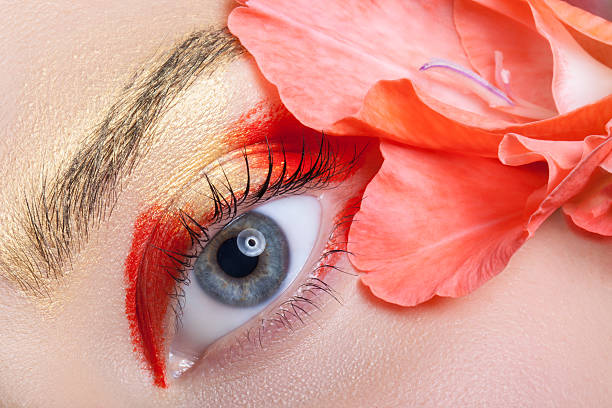 istock Beautiful eye make-up and flowers. 490668816