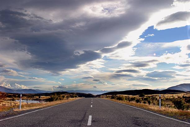 istock Dramatic clouds over road landscape in New Zealand 490669122