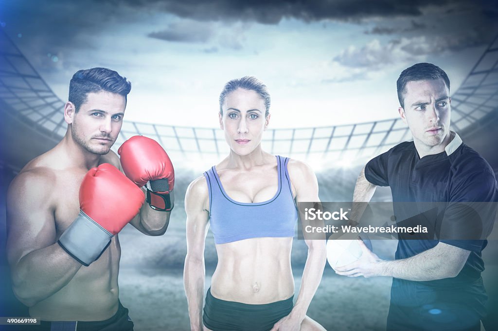 Composite image of fit people Fit people against stadium 20-29 Years Stock Photo