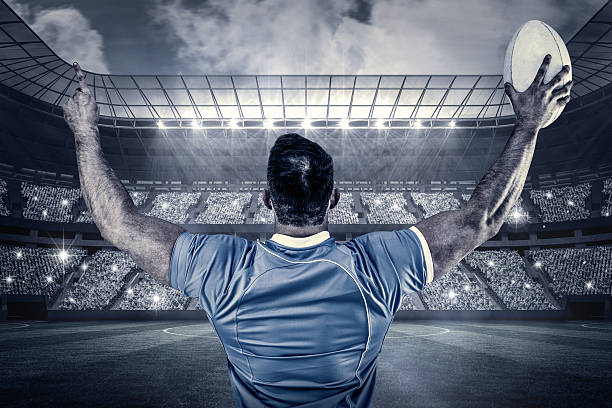 istock Composite image of rugby player cheering with the ball 490671114