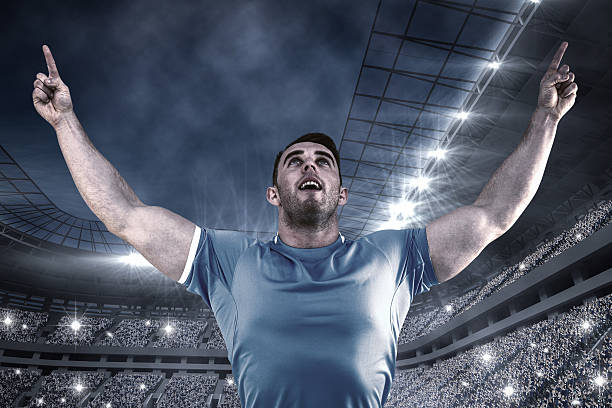 istock Composite image of rugby player cheering and pointing 490671136