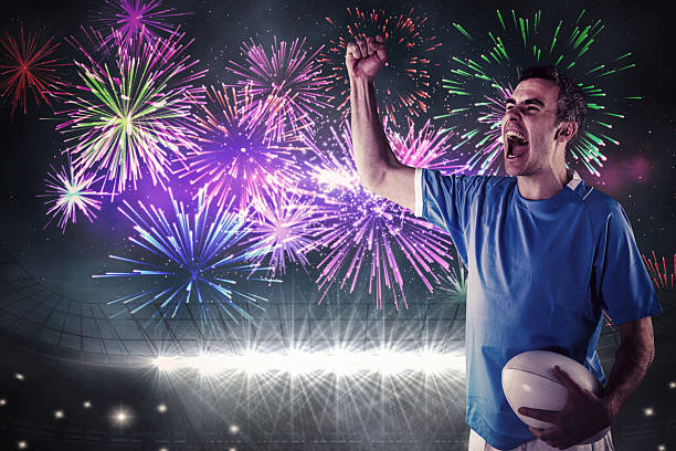 istock Composite image of a rugby player gesturing victory 490671504