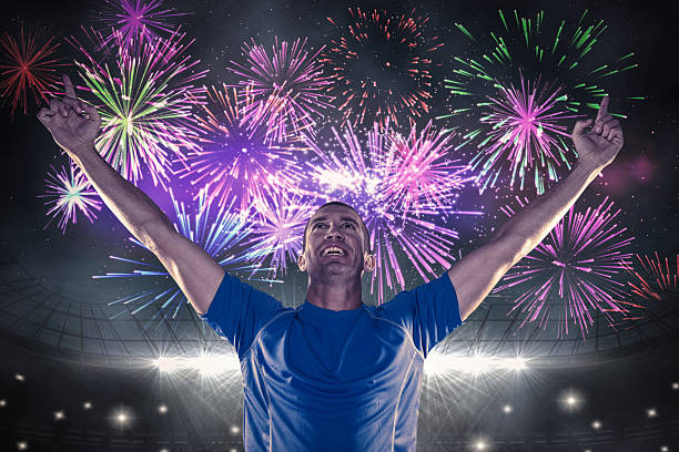 istock Composite image of happy rugby player with arms raised 490671778