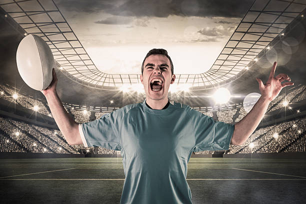 istock Composite image of a rugby player gesturing victory 490672272