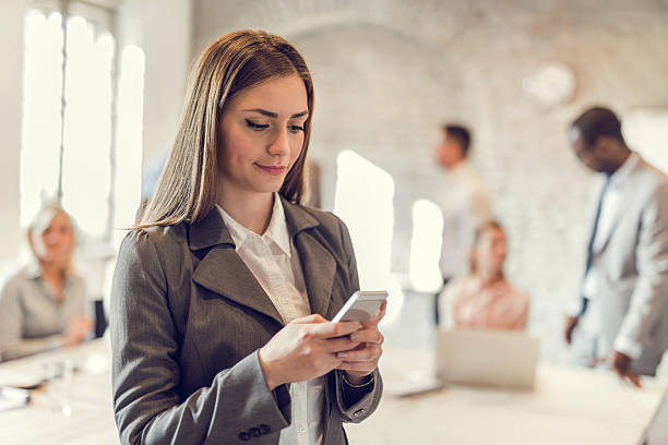 istock Young businesswoman using smart phone in the office. 490672572