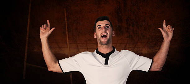 istock Composite image of surprised rugby player pointing up 490672638