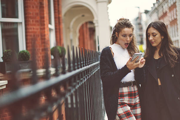 istock Fancy women in London using a mobile phone 490682848