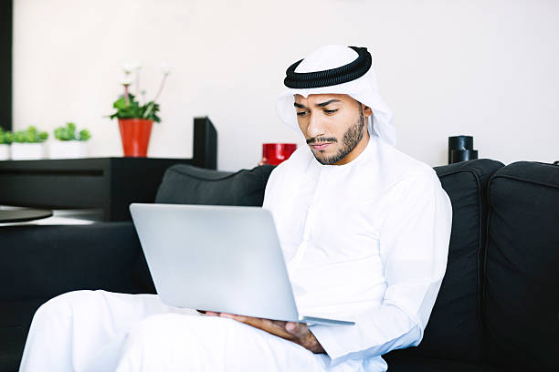 istock Concerned Arab Man Looking at His Laptop 490683676