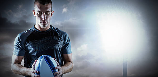 istock Composite image of thoughtful rugby player holding ball 490683824