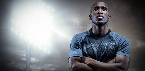 istock Composite image of thoughtful athlete standing with arms crossed 490684480