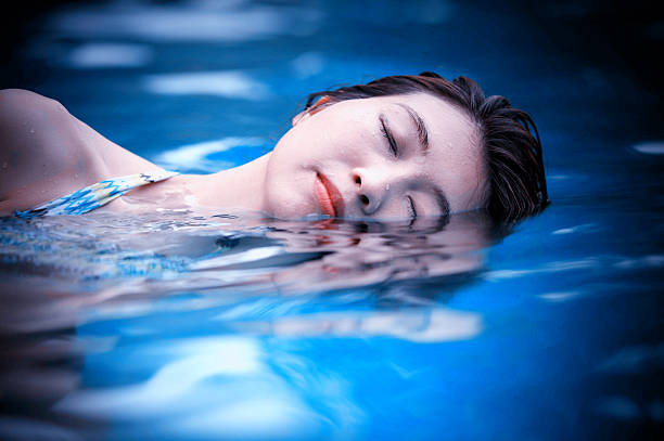 istock Young woman in the swimming pool 490686578