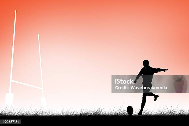 Composite Image Of Rugby Player Doing A Drop Kick Stock Photo - Download Image Now - 20-29 Years, 2015, 25-29 Years