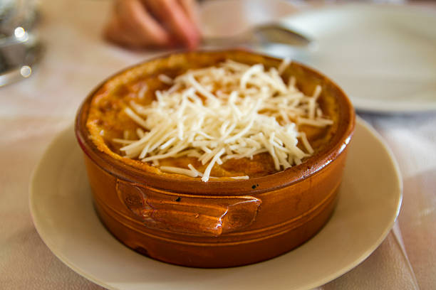 istock Greek mousaka with cheese in a hot pot. 490688862