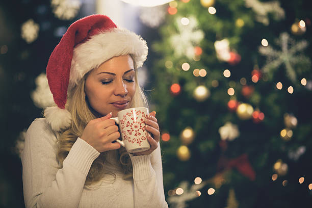istock Woman enjoying coffee at Christmas 490690816
