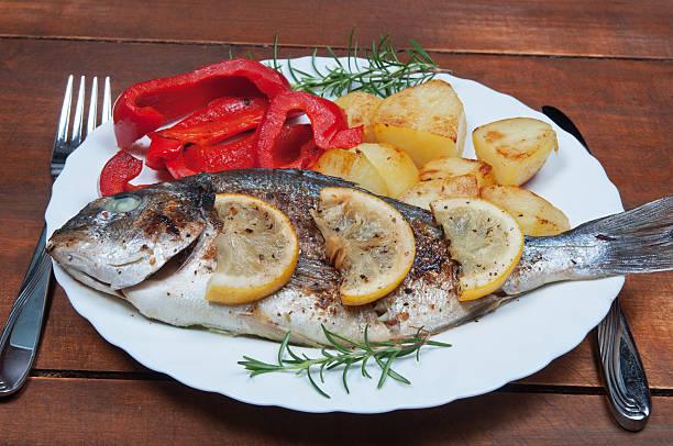 istock Grilled sea bream fish with vegetables 490691049