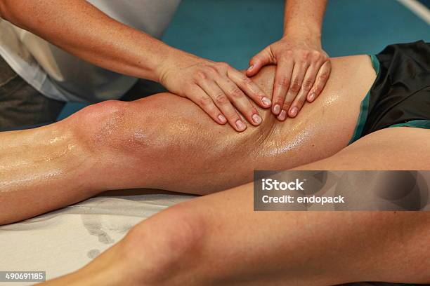 Hands Massaging Athletes Thigh After Running Stock Photo - Download Image Now - Massaging, Sport, Massage Therapist