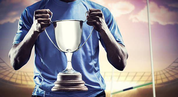 istock Composite image of rugby player with winners cup 490691334